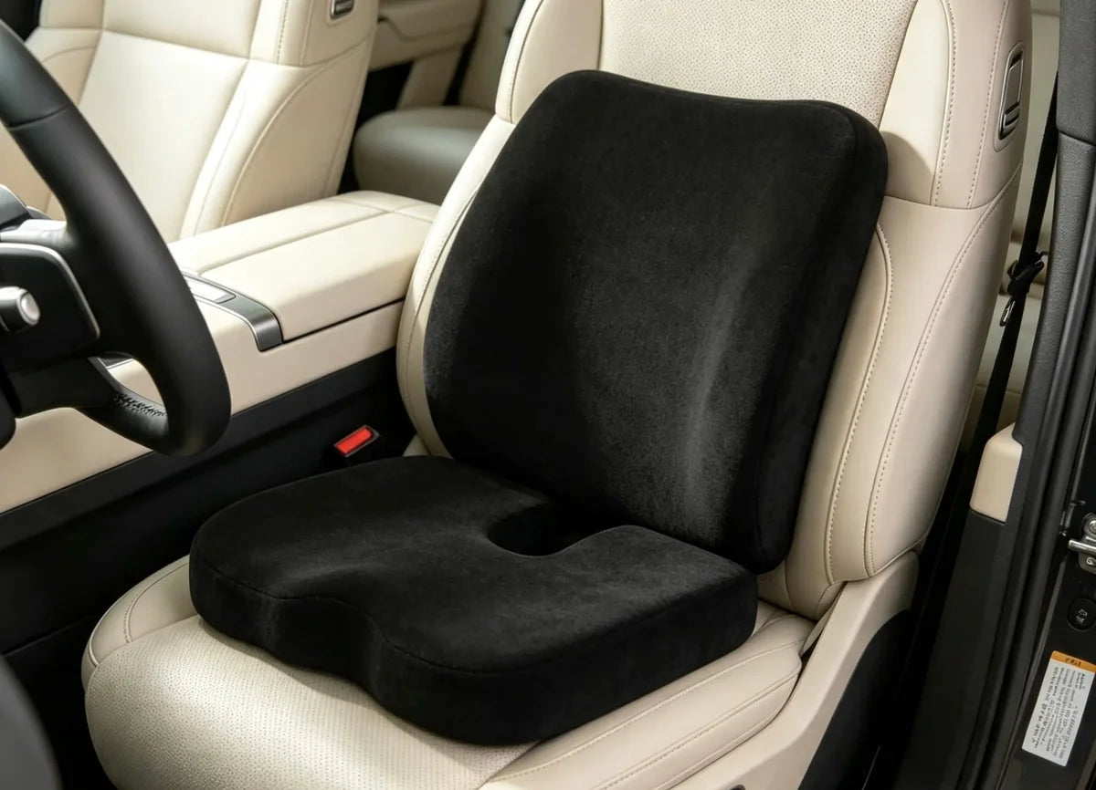 Black cushion and lumbar pillow fitted on a car seat